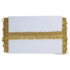 Gold fringe trim on a white background