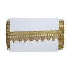 Gold fringe table runner on a white background