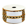 Roll of ribbon with black and gold pattern on a white background