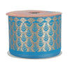 Roll of blue and gold patterned ribbon on a white background