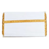 White clutch with gold trim on a white background