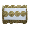 Decorative gold trim with circular patterns on a white card