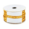 Spool of gold ribbon with a white label on a white background