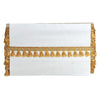 White clutch with gold tassel detailing on a white background