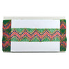Colorful woven clutch with a white card on a white background