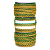 Set of green and gold bangles on a white background