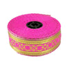 Roll of pink and gold decorative tape on a white background