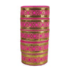 Set of pink and gold bangles on a white background