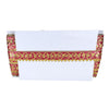 White fabric with red and gold decorative border on a white background