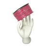 Pink and silver ribbon on a mannequin hand against a white background