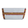 White clutch bag with gold and pink decorative trim on a white background
