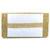 Gold woven card holder with a white card inside on a white background