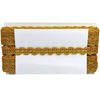 Decorative trim with gold and green pattern on a white background