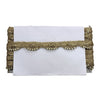 White clutch with gold braided trim on a white background