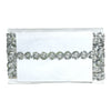 White clutch bag with silver embellishments on a white background