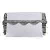 White clutch with silver embellishments on a white background