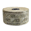 Roll of decorative ribbon with floral pattern on a white background