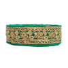 Green headband with gold lace and sequins on a white background