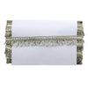 Decorative clutch with fringe details on a white background