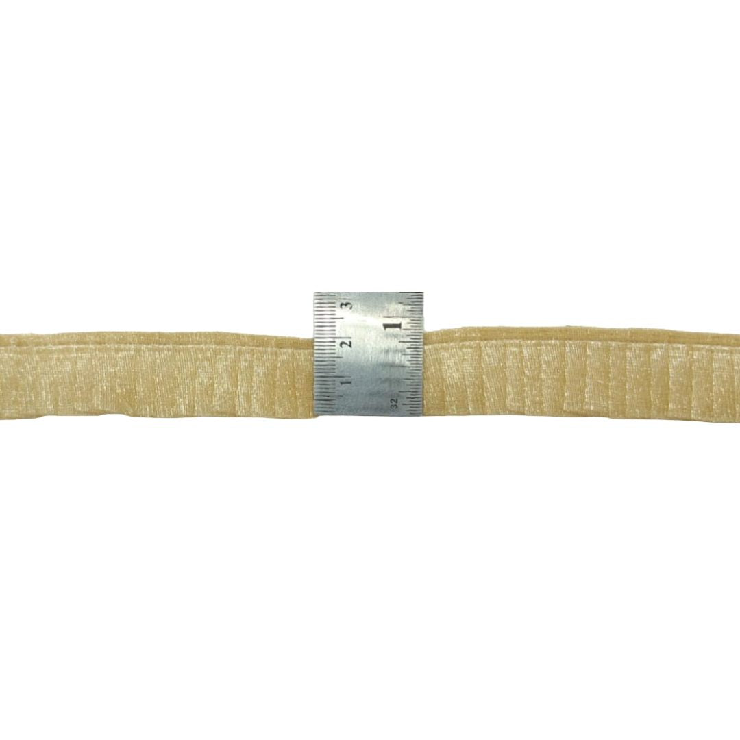 Beige webbing strap with a metal ruler showing measurement on a white background
