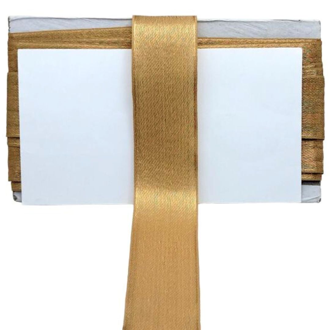 Folded white fabric with gold ribbon and wooden border on a white background