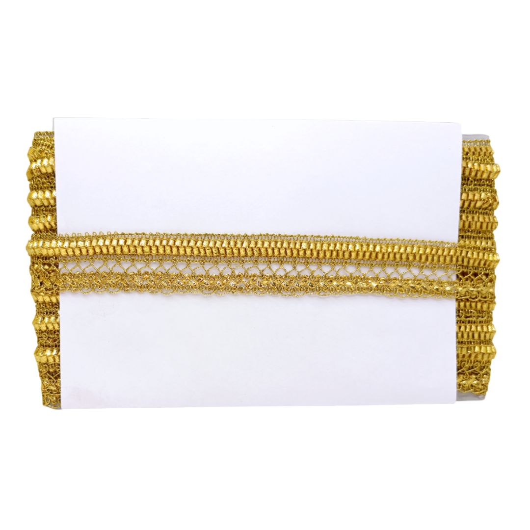 Gold clutch bag with intricate design on a white background