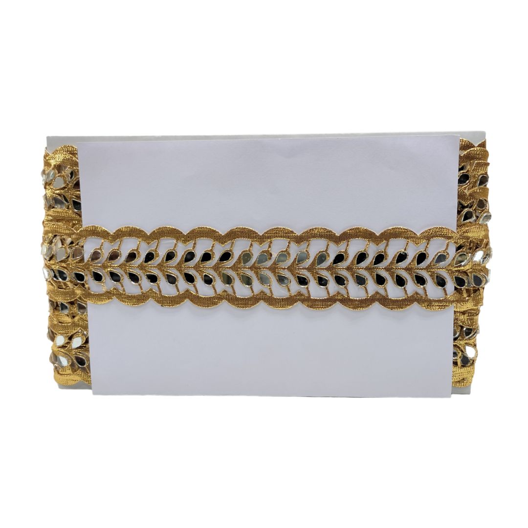 Gold and white decorative clutch on a white background