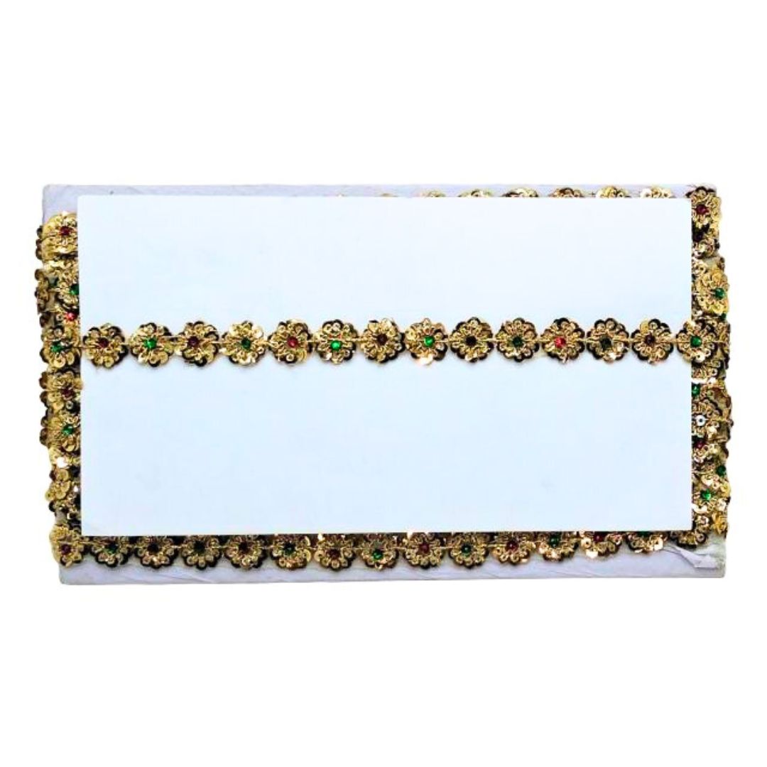 Decorative clutch with gold and green embellishments on a white background