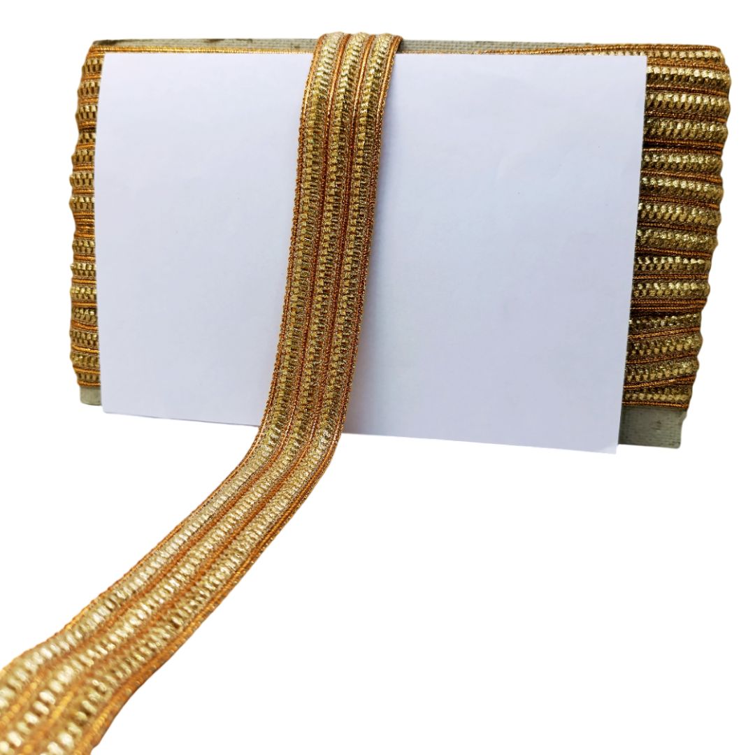 Gold ribbon with decorative pattern on a white background