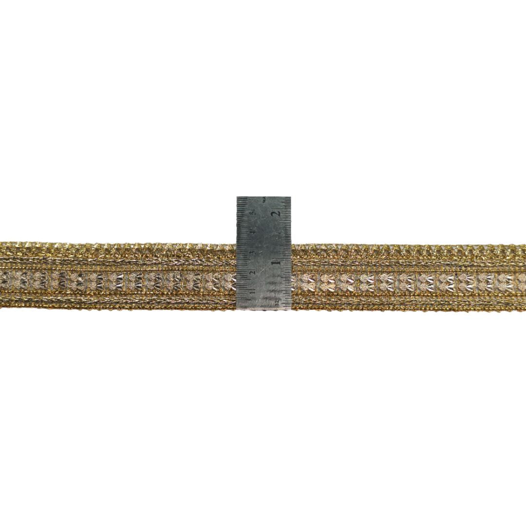 Gold woven belt with a ruler for scale on a white background