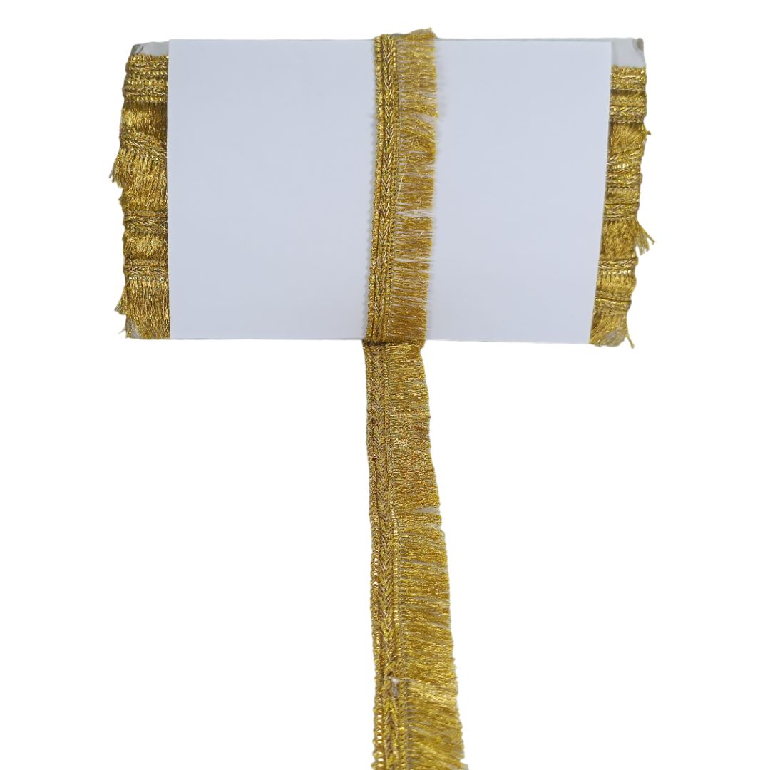 Gold fringe table runner on a white background