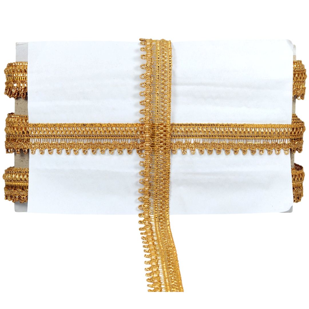 White pillow with gold decorative trim on a white background