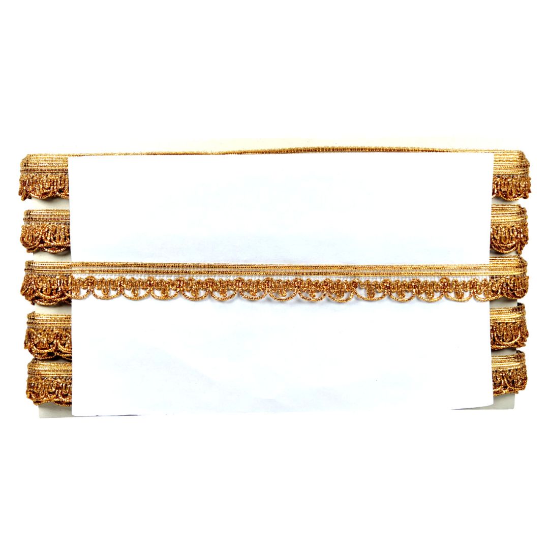 Decorative gold lace trim on a white background