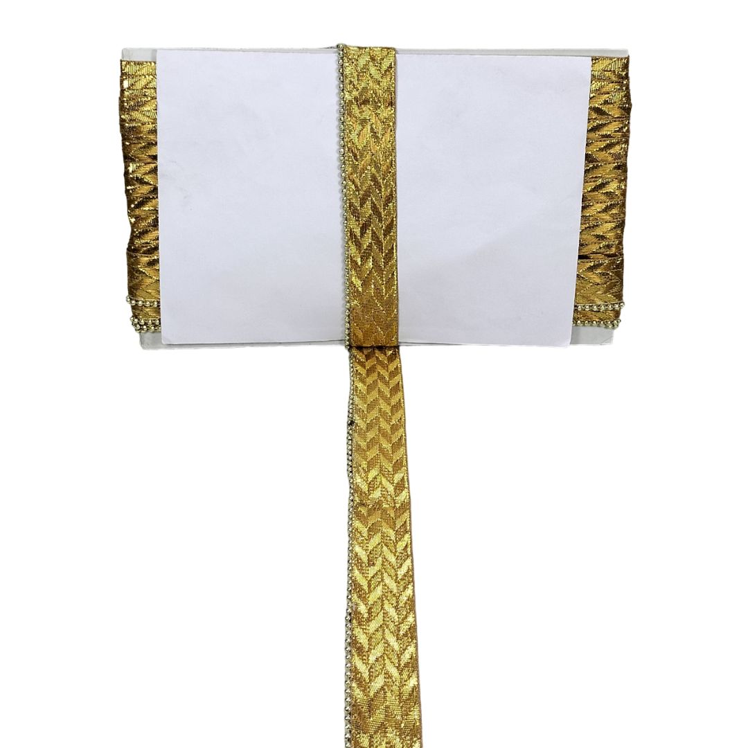 White fabric with gold embroidery on a white background