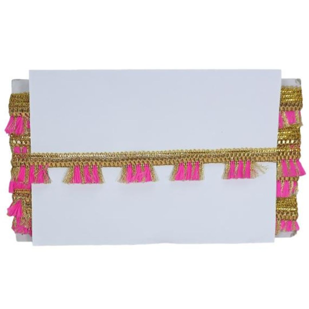 White paper with gold and pink tassels on a white background