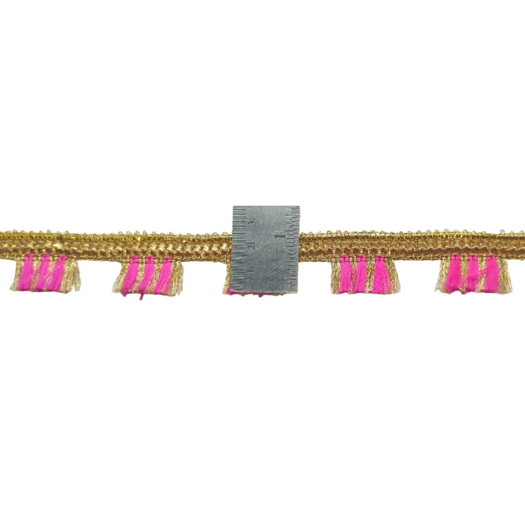 Decorative trim with gold fringe and pink tassels on a white background