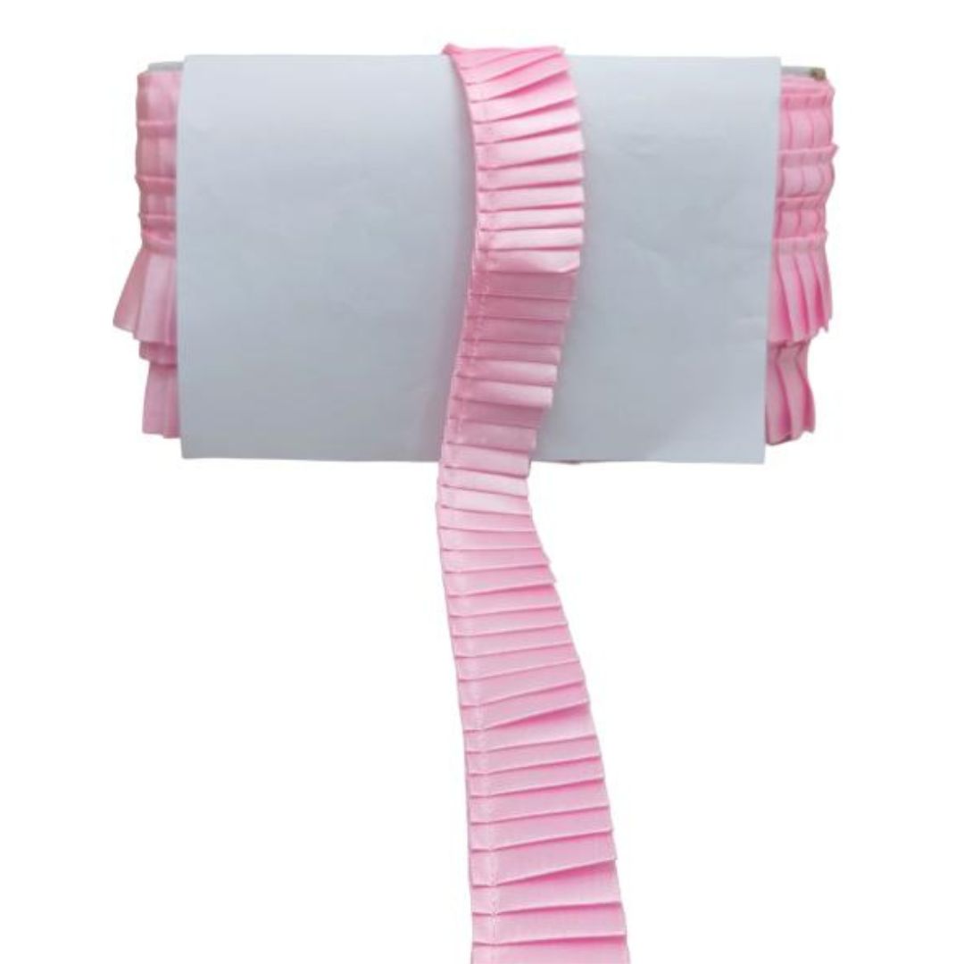 Pink ruffled trim on a white background