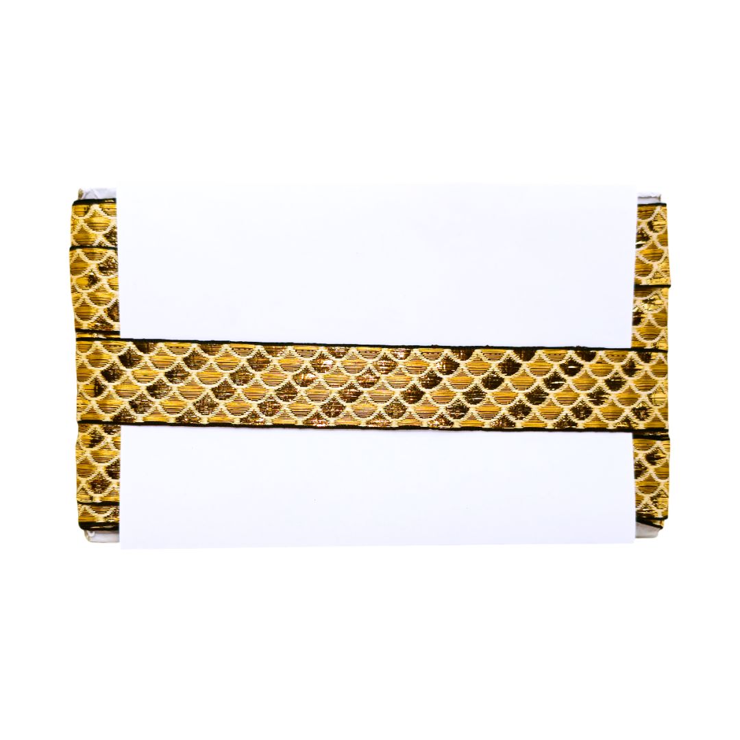 Decorative headboard with gold and black pattern on a white background