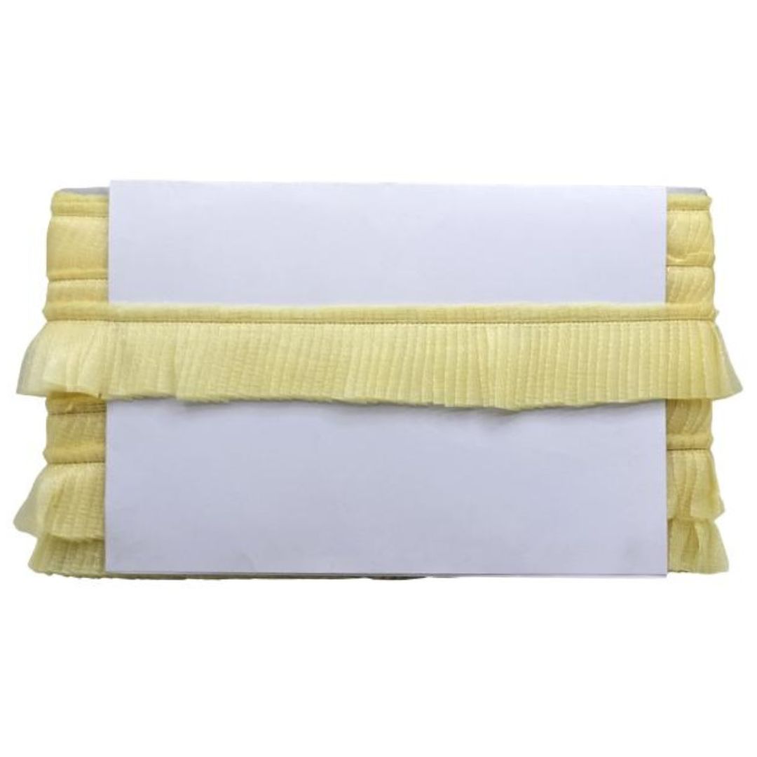 Stack of yellow folded towels on a white background