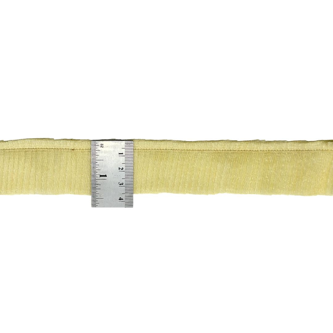 Yellow webbing strap with a metal ruler for measurement on a white background