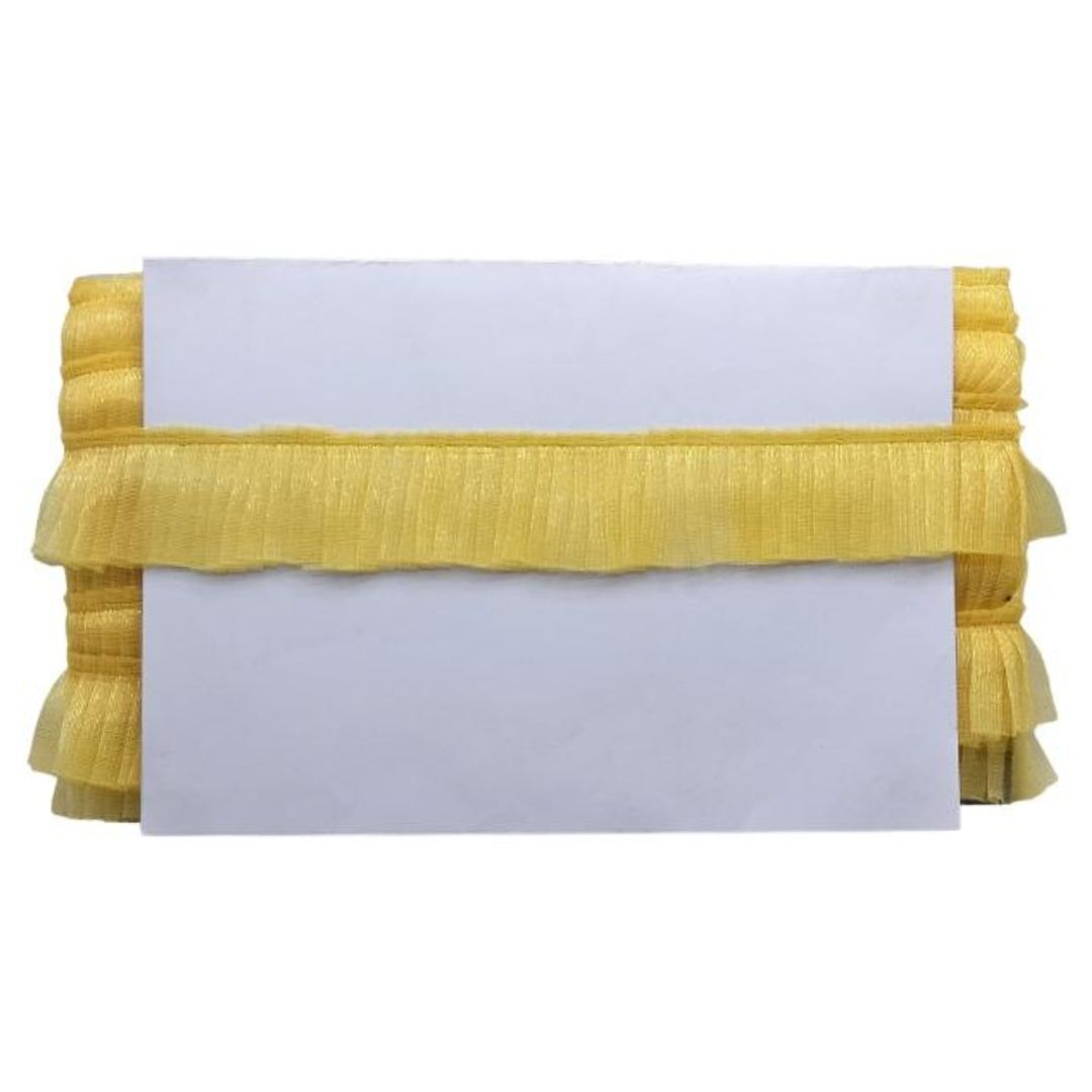 Yellow textured clutch bag with a white card on a white background