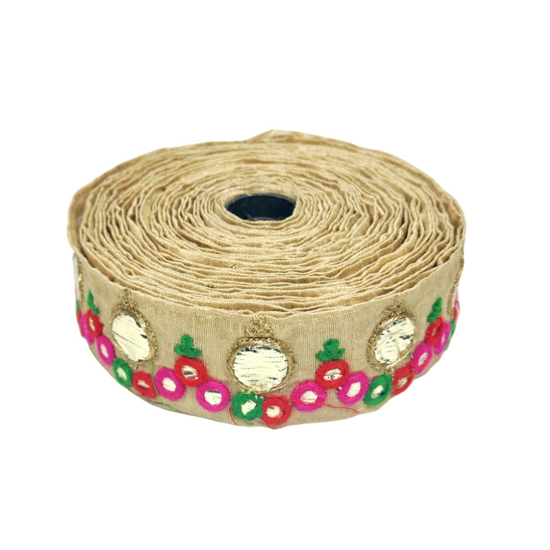 Roll of decorative ribbon with floral patterns on a white background
