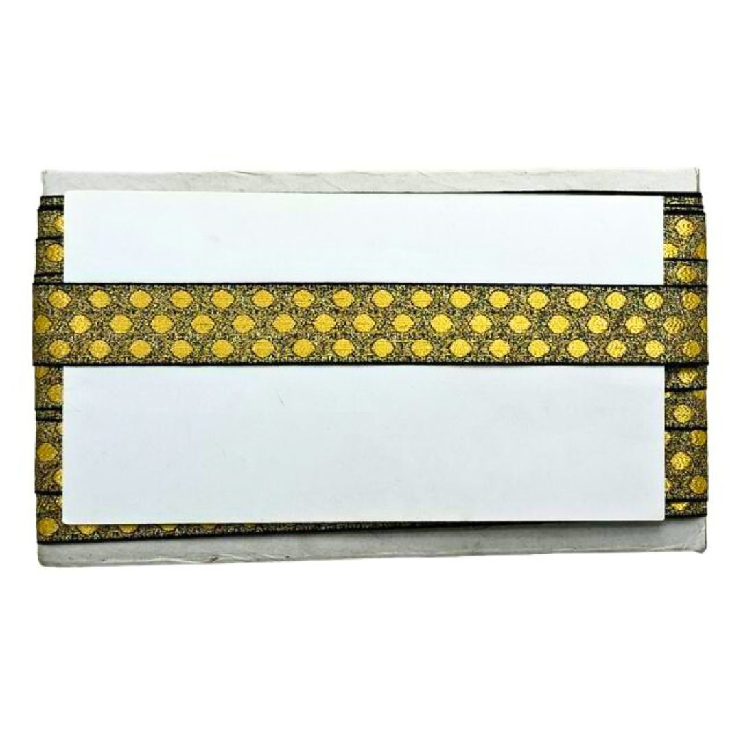 White clutch with gold polka dot trim on a white background