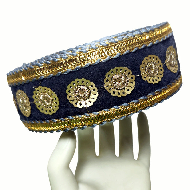 Decorative headband with gold embellishments on a white mannequin head