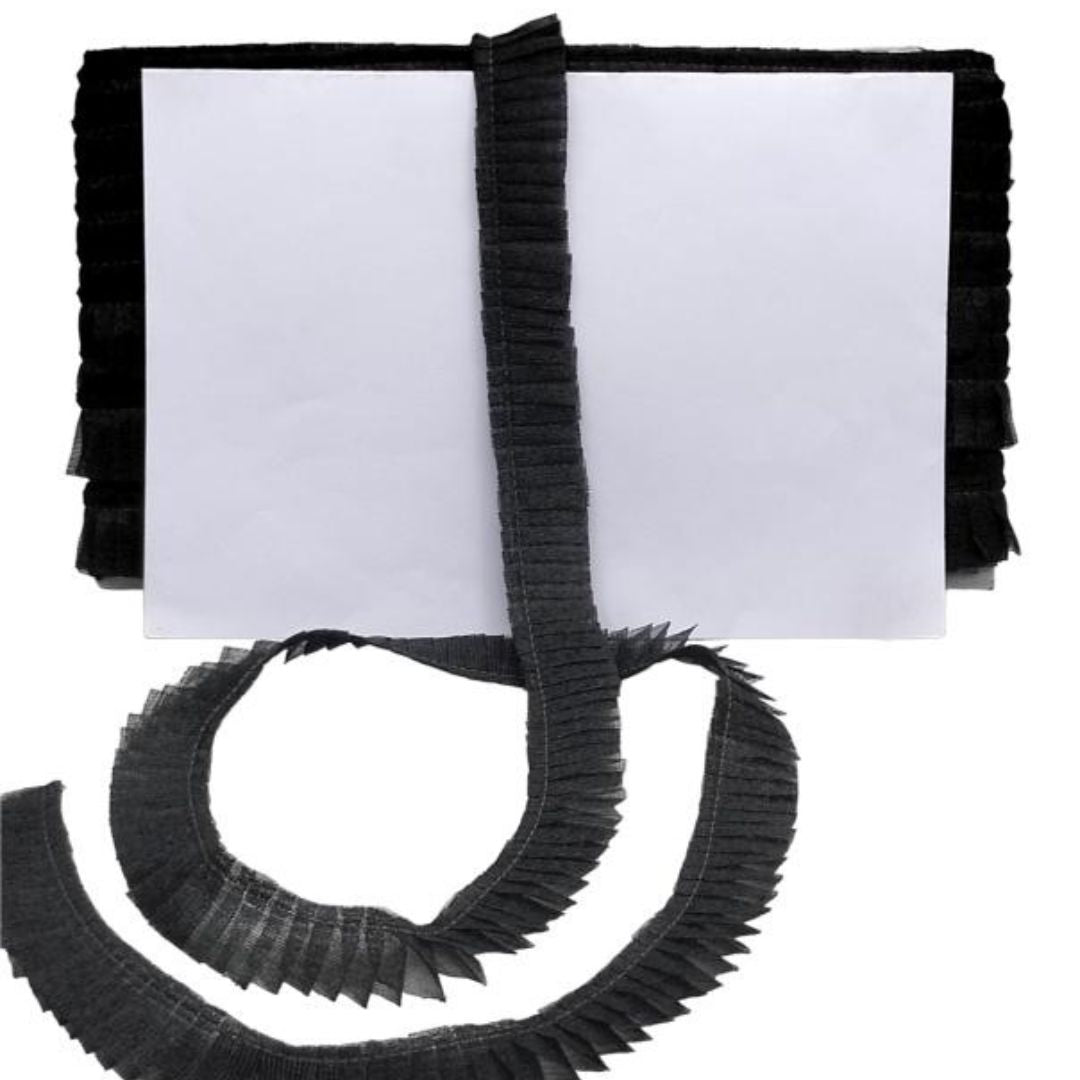 Black ribbed belt with a white label on a white background