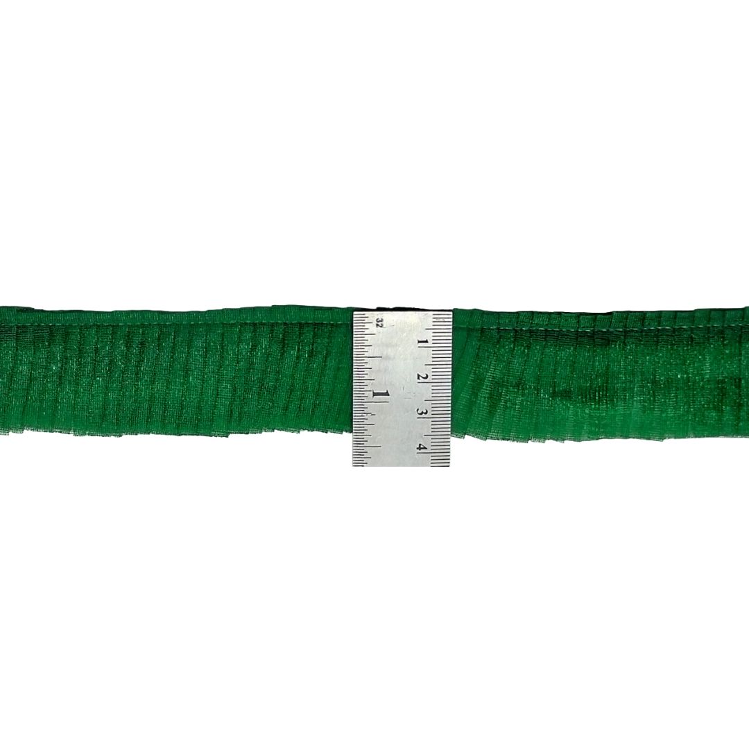 Green belt with a ruler for size reference on a white background