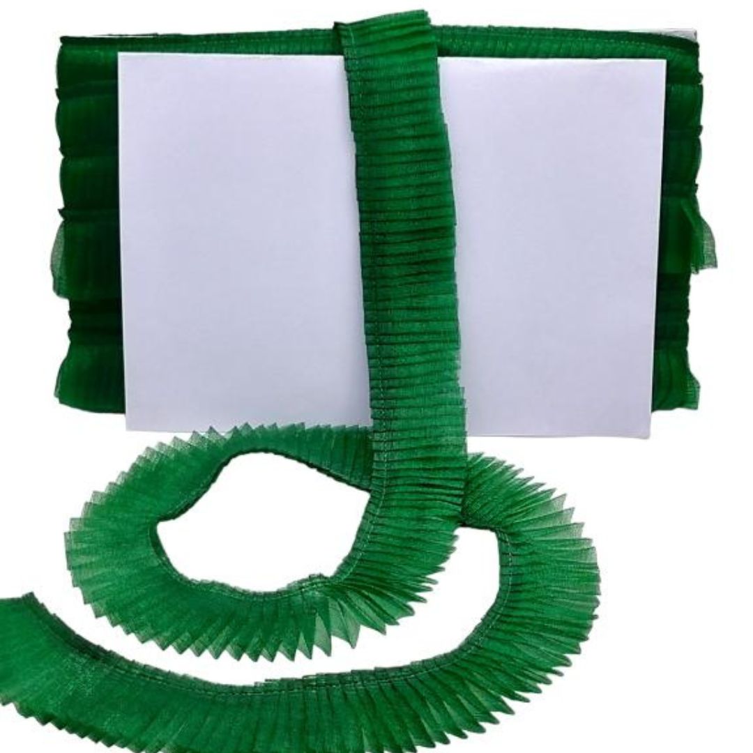 Green ribbons with a white card on a white background