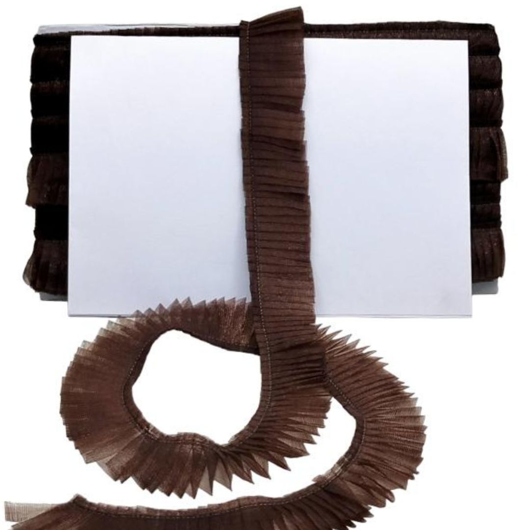 Brown pleated trim on a white background
