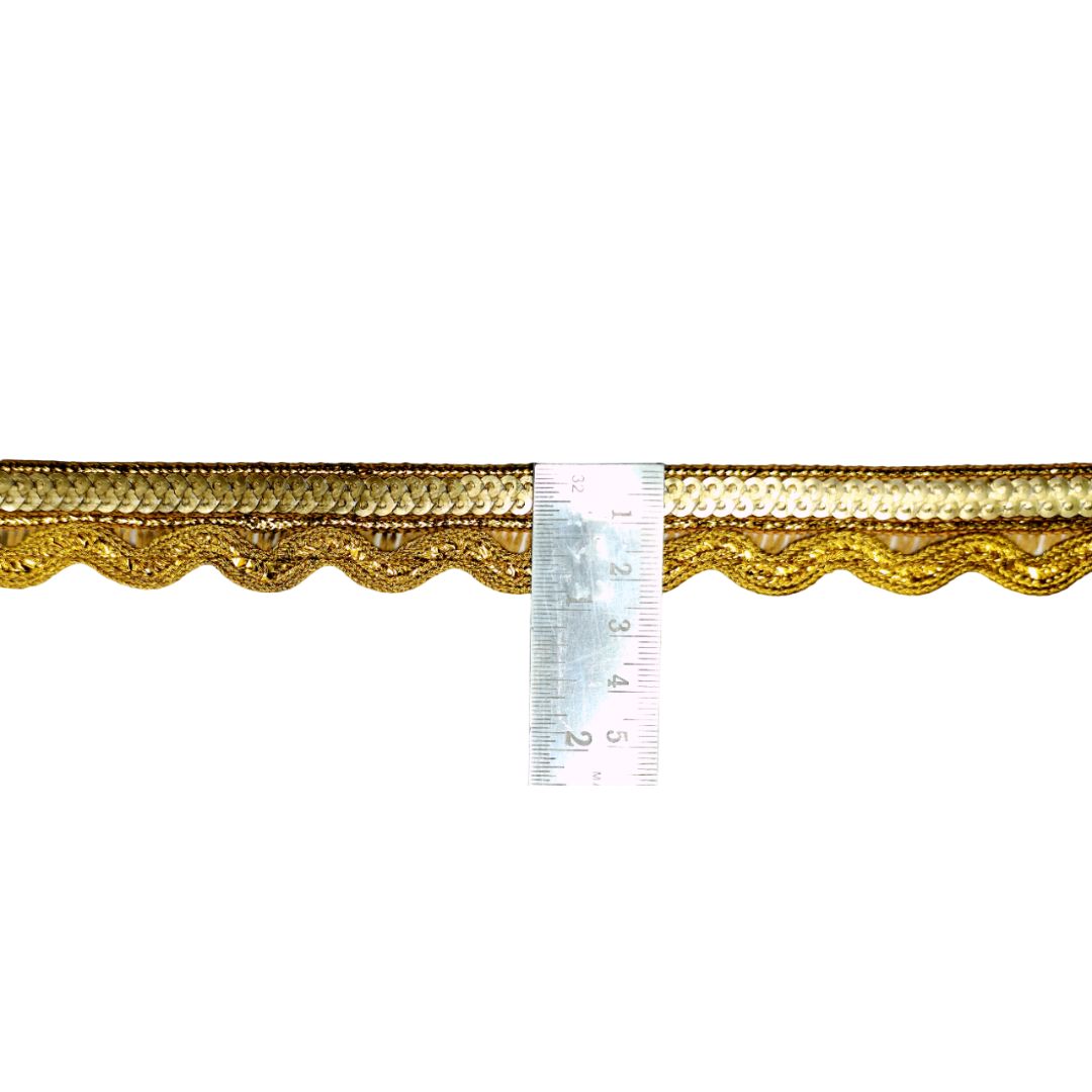 Gold decorative trim with a ruler for scale on a white background