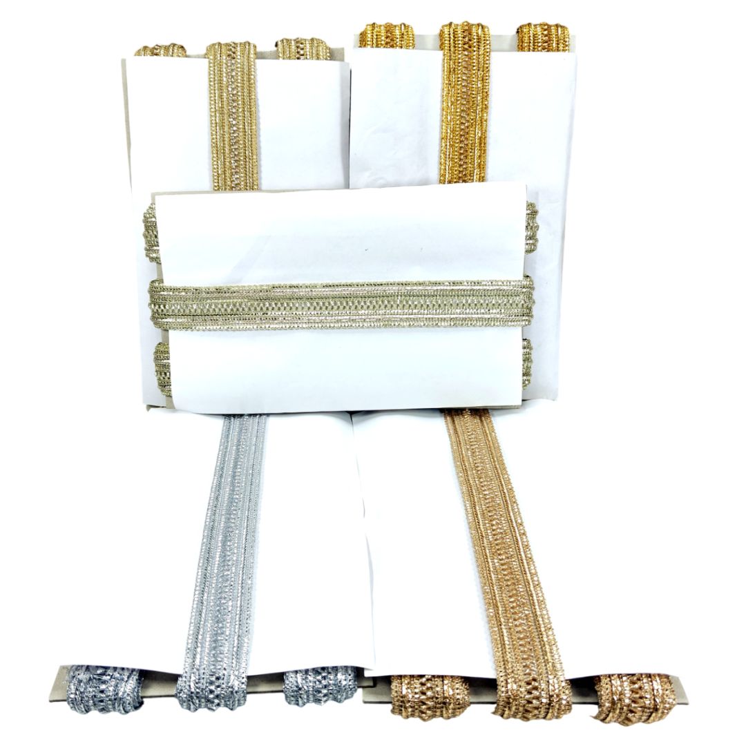 Set of white napkins with gold and silver trim on a white background